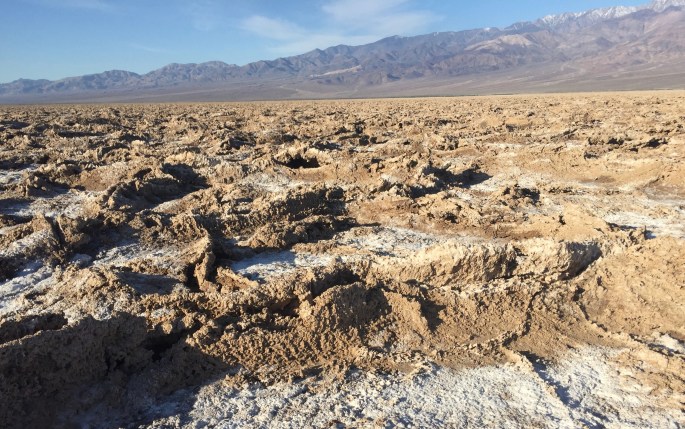 The terrain becomes rough as salt and dried mud mix.
