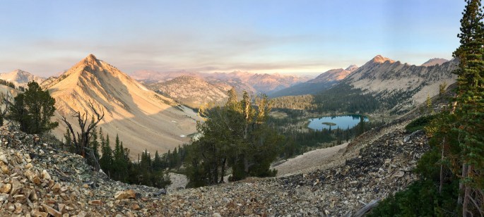 Smoke mixes with clouds in the distance.