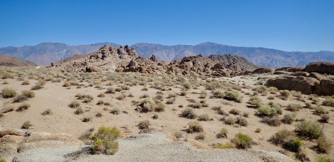 The backdrop for this rock scene is the Inyo mountains.