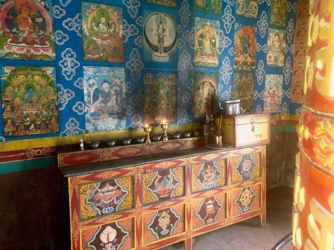 An altar inside the stupa and next to the mani wheel