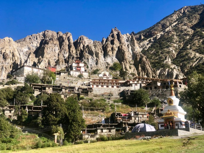 Bottom right: Stupa.  Center: Gompa (monastery).  Top: Badlands.