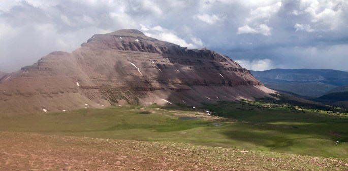 One of many reddish-brown mountains forms a dramatic wall